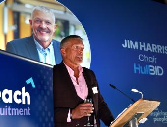 Jim Harris, Chair of Hull BID, stood delivering a presentation.