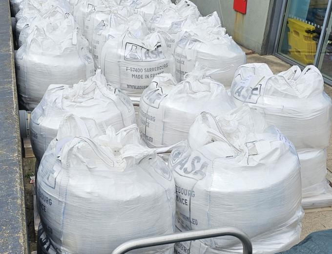 A line of industrial size salt bags outside The Deep building.